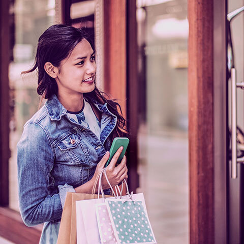 Lady holding her Cellphone premium banking